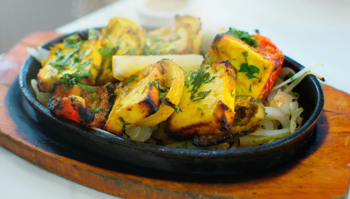 Golden layered crisp parathas on the tawa